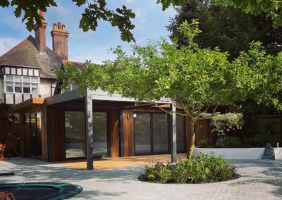 Garden room, hard landscaping, paving, decking, trampoline, tree