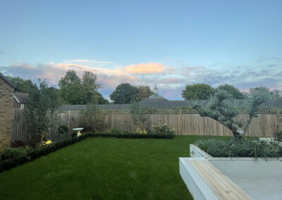 Garden design, lawn, outdoor seating, fencing, birdbath, hard landscaping.
